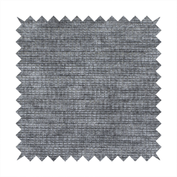A dark charcoal grey fabric with a dense horizontal ribbed texture. The weave features a soft, plush pile with subtle weathered variations, creating a multi-tonal smoky effect that adds depth and a sophisticated matte finish.