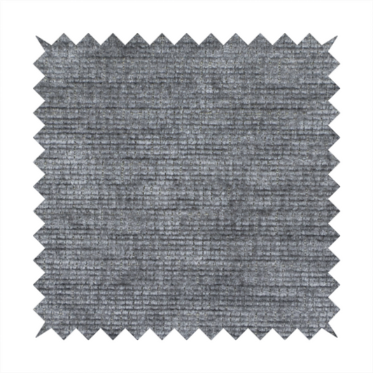 A dark charcoal grey fabric with a dense horizontal ribbed texture. The weave features a soft, plush pile with subtle weathered variations, creating a multi-tonal smoky effect that adds depth and a sophisticated matte finish.