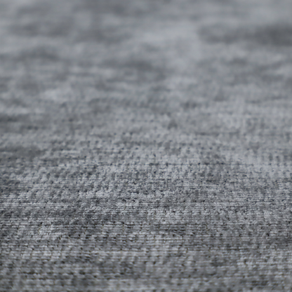 A dark charcoal grey fabric with a dense horizontal ribbed texture. The weave features a soft, plush pile with subtle weathered variations, creating a multi-tonal smoky effect that adds depth and a sophisticated matte finish.