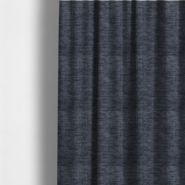 The fabric used to create these made-to-measure curtains is a deep navy-charcoal fabric with a dense horizontal ribbed texture. The material has a soft, plush pile that creates a subtle multi-tonal effect, blending dark midnight blue and charcoal grey tones with a durable matte finish.