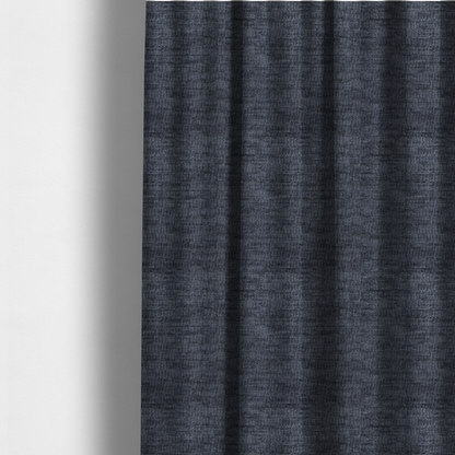 The fabric used to create these made-to-measure curtains is a deep navy-charcoal fabric with a dense horizontal ribbed texture. The material has a soft, plush pile that creates a subtle multi-tonal effect, blending dark midnight blue and charcoal grey tones with a durable matte finish.