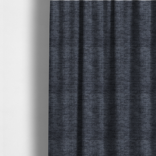 The fabric used to create these made-to-measure curtains is a deep navy-charcoal fabric with a dense horizontal ribbed texture. The material has a soft, plush pile that creates a subtle multi-tonal effect, blending dark midnight blue and charcoal grey tones with a durable matte finish.