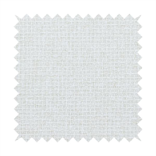 A light-coloured, woven contract fabric. The material features a fine, grid-like texture resembling a mix of linen and grass cloth in a neutral off-white or pale pearl tone. The weave creates a subtle, matte geometric pattern with delicate shadows that give the surface a tactile, three-dimensional appearance.