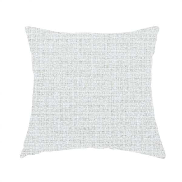 The fabric used to create these handmade cushions is a light-coloured, woven contract fabric. The material features a fine, grid-like texture resembling a mix of linen and grass cloth in a neutral off-white or pale pearl tone. The weave creates a subtle, matte geometric pattern with delicate shadows that give the surface a tactile, three-dimensional appearance.