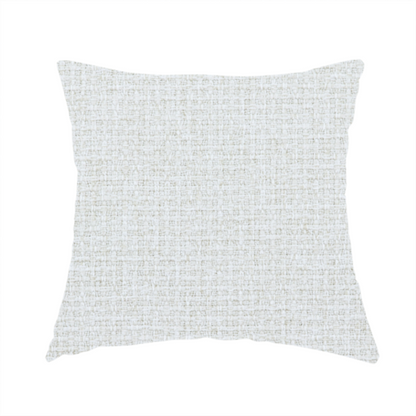 The fabric used to create these handmade cushions is a light-coloured, woven contract fabric. The material features a fine, grid-like texture resembling a mix of linen and grass cloth in a neutral off-white or pale pearl tone. The weave creates a subtle, matte geometric pattern with delicate shadows that give the surface a tactile, three-dimensional appearance.