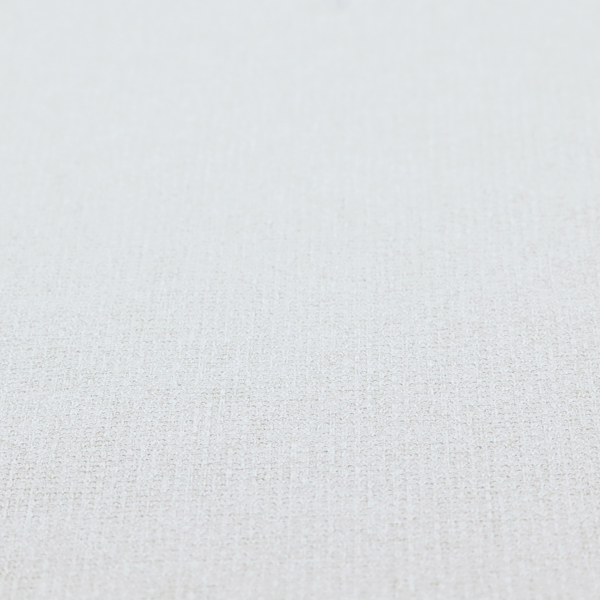 A light-coloured, woven contract fabric. The material features a fine, grid-like texture resembling a mix of linen and grass cloth in a neutral off-white or pale pearl tone. The weave creates a subtle, matte geometric pattern with delicate shadows that give the surface a tactile, three-dimensional appearance.