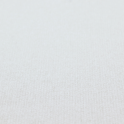 A light-coloured, woven contract fabric. The material features a fine, grid-like texture resembling a mix of linen and grass cloth in a neutral off-white or pale pearl tone. The weave creates a subtle, matte geometric pattern with delicate shadows that give the surface a tactile, three-dimensional appearance.