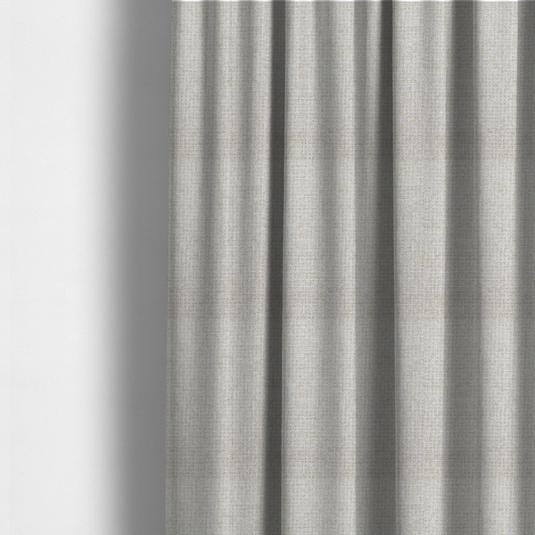 The fabric used to create these made-to-measure curtains is a warm off-white or light oatmeal shade. The textile features a dense, multi-tonal basket weave pattern with visible interlacing threads in cream and soft beige, creating a textured, linen-look surface.