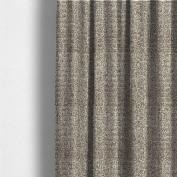 The fabric used to create these made-to-measure curtains is an upholstery fabric in a versatile taupe or mushroom shade. The textile features a dense, multi-tonal weave with interlacing fibres of cool grey, beige, and cream, creating a sophisticated textured linen-look surface.