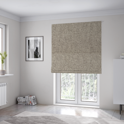 The fabric used to create these Roman blinds is a upholstery fabric in a versatile taupe or mushroom shade. The textile features a dense, multi-tonal weave with interlacing fibres of cool grey, beige, and cream, creating a sophisticated textured linen-look surface.