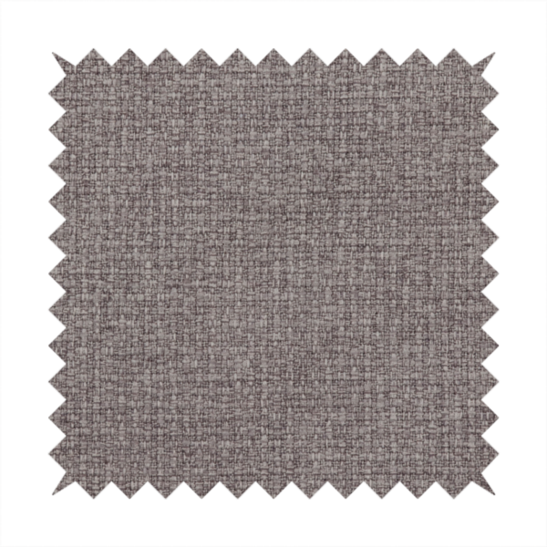 An upholstery fabric in a sophisticated mink or warm grey shade. The textile features a tight, multi-tonal weave with interlacing threads of deep taupe, charcoal, and soft brown, creating a rich, textured surface with a matte finish.