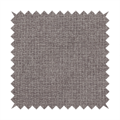 An upholstery fabric in a sophisticated mink or warm grey shade. The textile features a tight, multi-tonal weave with interlacing threads of deep taupe, charcoal, and soft brown, creating a rich, textured surface with a matte finish.