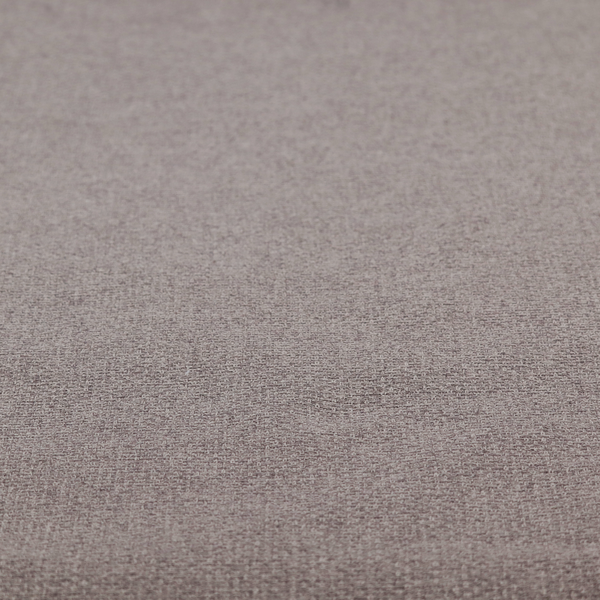 An upholstery fabric in a sophisticated mink or warm grey shade. The textile features a tight, multi-tonal weave with interlacing threads of deep taupe, charcoal, and soft brown, creating a rich, textured surface with a matte finish.