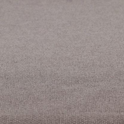 An upholstery fabric in a sophisticated mink or warm grey shade. The textile features a tight, multi-tonal weave with interlacing threads of deep taupe, charcoal, and soft brown, creating a rich, textured surface with a matte finish.