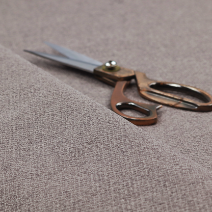 An upholstery fabric in a sophisticated mink or warm grey shade. The textile features a tight, multi-tonal weave with interlacing threads of deep taupe, charcoal, and soft brown, creating a rich, textured surface with a matte finish.