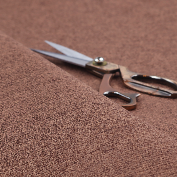 An upholstery fabric in a rich cocoa or cedar brown shade. The textile features a dense, multi-tonal weave with interlaced threads of deep chocolate and warm earth tones, creating a sophisticated textured linen-look surface.