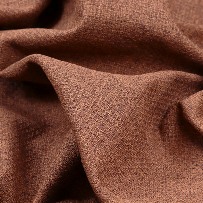 An upholstery fabric in a warm terracotta or burnt orange shade. The textile features a multi-tonal basket weave with interlacing copper and dark brown threads, creating a rich, textured linen-look surface with an earthy, matte finish.
