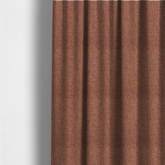 The fabric used to create these made-to-measure curtains is a upholstery fabric in a warm terracotta or burnt orange shade. The textile features a multi-tonal basket weave with interlacing copper and dark brown threads, creating a rich, textured linen-look surface with an earthy, matte finish.