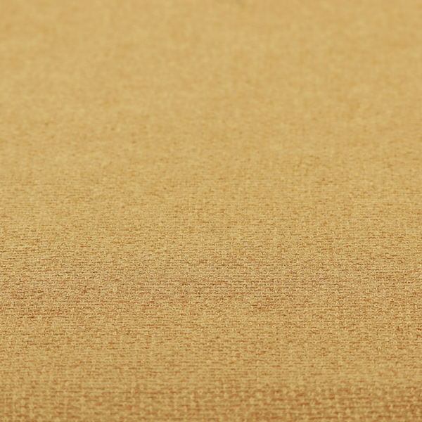 An upholstery fabric in a bright mustard or golden ochre shade. The textile features a dense, multi-tonal basket weave with interlacing threads of yellow, gold, and light tan, creating a vibrant, linen-look texture with a matte finish.