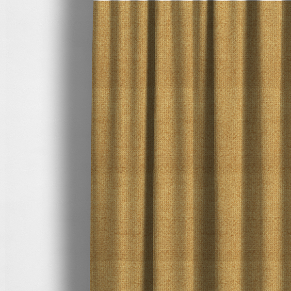 The fabric used to create these made-to-measure curtains is a upholstery fabric in a bright mustard or golden ochre shade. The textile features a dense, multi-tonal basket weave with interlacing threads of yellow, gold, and light tan, creating a vibrant, linen-look texture with a matte finish.