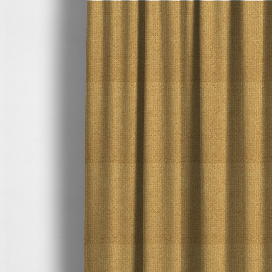 The fabric used to create these made-to-measure curtains is a upholstery fabric in a bright mustard or golden ochre shade. The textile features a dense, multi-tonal basket weave with interlacing threads of yellow, gold, and light tan, creating a vibrant, linen-look texture with a matte finish.