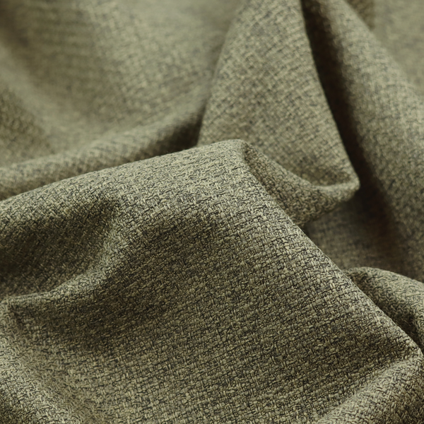 An upholstery fabric in an earthy olive or moss green shade. The textile features a dense, multi-tonal weave with interlaced threads of forest green, sage, and dark charcoal, creating a rich, textured linen-look surface with a matte finish.