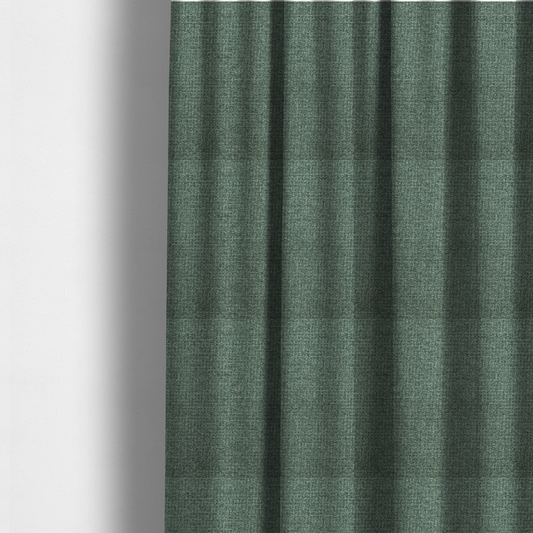 The fabric used to create these made-to-measure curtains is a upholstery fabric in a serene seafoam or muted teal shade. The textile features a dense, multi-tonal weave with interlacing threads of dusty blue-green and dark charcoal, creating a textured, linen-look surface with a matte finish.