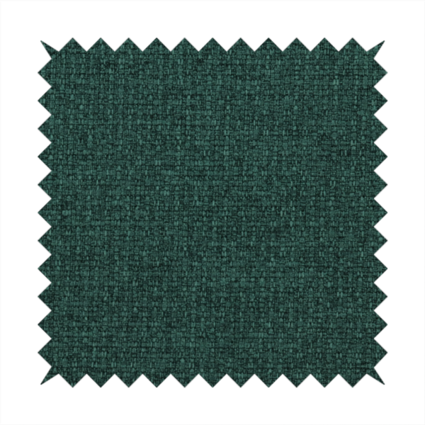 An upholstery fabric in a deep forest or emerald green shade. The textile features a dense, multi-tonal weave with interlaced threads of dark teal and charcoal, creating a rich, textured linen-look surface with a sophisticated matte finish.
