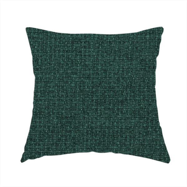 The fabric used to create handmade cushions is a upholstery fabric in a deep forest or emerald green shade. The textile features a dense, multi-tonal weave with interlaced threads of dark teal and charcoal, creating a rich, textured linen-look surface with a sophisticated matte finish.