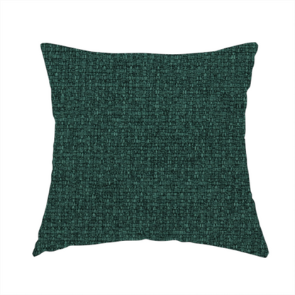 The fabric used to create handmade cushions is a upholstery fabric in a deep forest or emerald green shade. The textile features a dense, multi-tonal weave with interlaced threads of dark teal and charcoal, creating a rich, textured linen-look surface with a sophisticated matte finish.