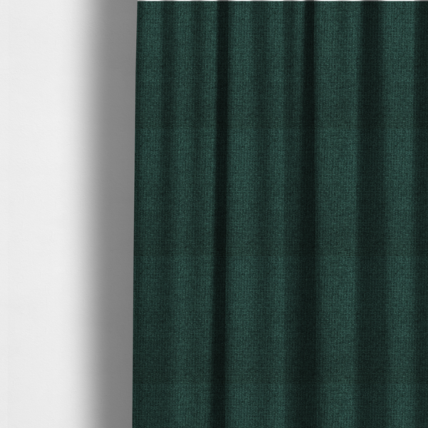 The fabric used to create these made-to-measure curtains is a upholstery fabric in a deep forest or emerald green shade. The textile features a dense, multi-tonal weave with interlaced threads of dark teal and charcoal, creating a rich, textured linen-look surface with a sophisticated matte finish.