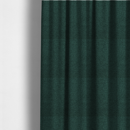 The fabric used to create these made-to-measure curtains is a upholstery fabric in a deep forest or emerald green shade. The textile features a dense, multi-tonal weave with interlaced threads of dark teal and charcoal, creating a rich, textured linen-look surface with a sophisticated matte finish.