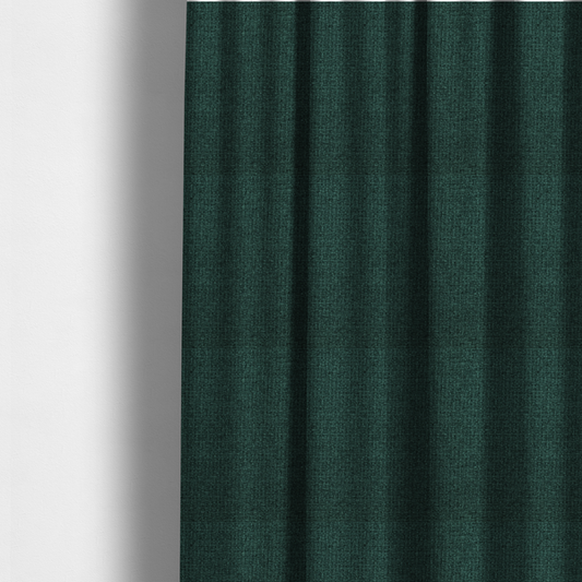 The fabric used to create these made-to-measure curtains is a upholstery fabric in a deep forest or emerald green shade. The textile features a dense, multi-tonal weave with interlaced threads of dark teal and charcoal, creating a rich, textured linen-look surface with a sophisticated matte finish.