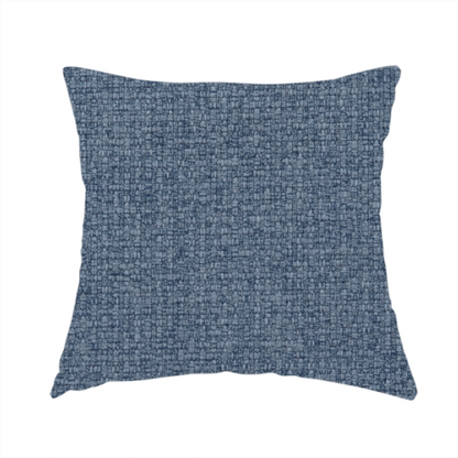 The fabric used to create this handmade cushion is a upholstery fabric in a classic navy or denim blue. The textile features a dense, multi-tonal weave with interlacing threads of royal blue, charcoal, and soft grey, creating a rich, textured linen-look surface with a matte finish.