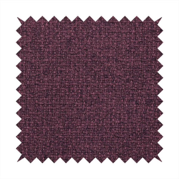 an upholstery fabric in a rich plum or deep burgundy shade. The textile features a dense, multi-tonal weave with interlacing threads of dark purple, berry, and charcoal, creating a textured, linen-look surface with a sophisticated matte finish.