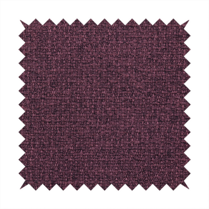 an upholstery fabric in a rich plum or deep burgundy shade. The textile features a dense, multi-tonal weave with interlacing threads of dark purple, berry, and charcoal, creating a textured, linen-look surface with a sophisticated matte finish.