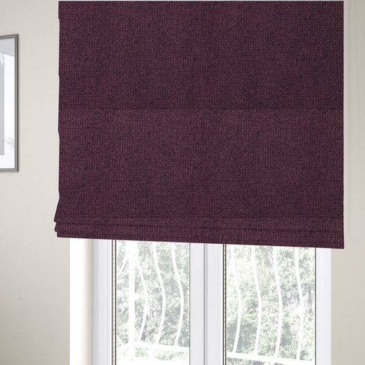The fabric used to create these Roman blinds is a upholstery fabric in a rich plum or deep burgundy shade. The textile features a dense, multi-tonal weave with interlacing threads of dark purple, berry, and charcoal, creating a textured, linen-look surface with a sophisticated matte finish.