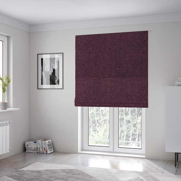 The fabric used to create these Roman blinds is a upholstery fabric in a rich plum or deep burgundy shade. The textile features a dense, multi-tonal weave with interlacing threads of dark purple, berry, and charcoal, creating a textured, linen-look surface with a sophisticated matte finish.