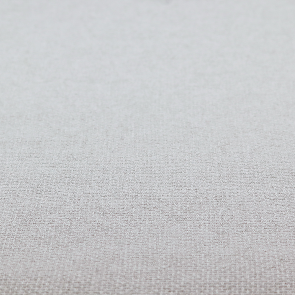 A fabric in a cool-toned light silver or pale grey. The weave features interlaced white and soft grey threads, creating a bright, contemporary textured finish.