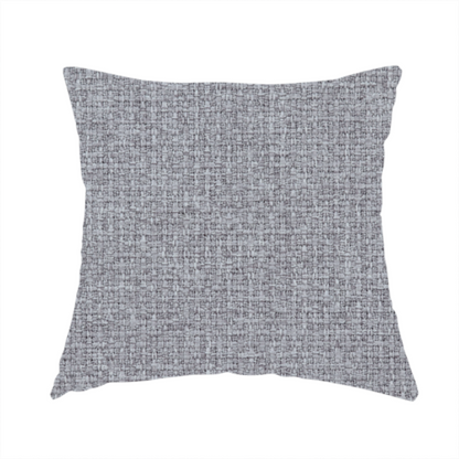The fabric used to create this handmade cushion is a upholstery fabric in a cool pebble grey. The interlacing of light grey and off-white threads creates a clean, contemporary basket weave pattern with a matte finish.