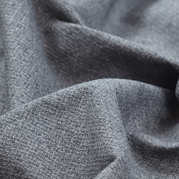 A fabric in a dark steel or charcoal grey. The high-contrast weave features interlaced light grey and deep black fibres, creating a rugged, textured surface.