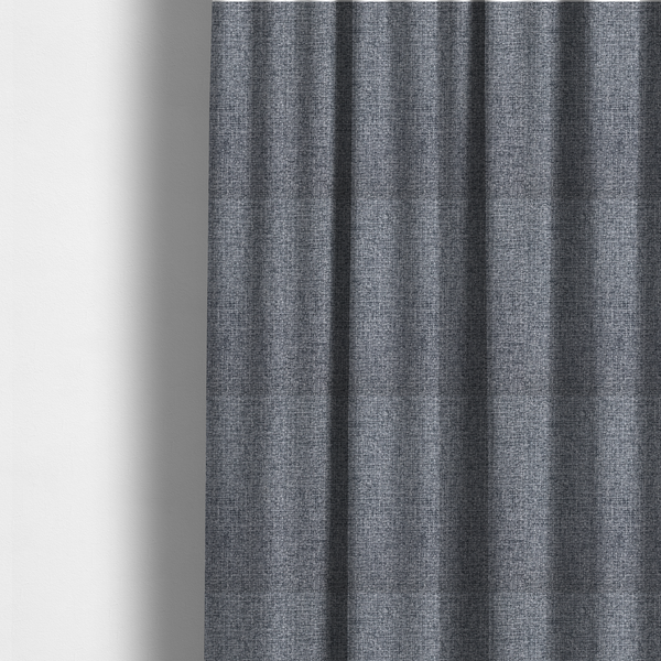 The fabric used to create these made-to-measure curtains is a fabric in a dark steel or charcoal grey. The high-contrast weave features interlaced light grey and deep black fibres, creating a rugged, textured surface.