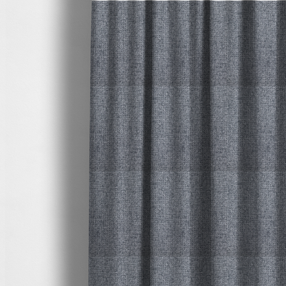 The fabric used to create these made-to-measure curtains is a fabric in a dark steel or charcoal grey. The high-contrast weave features interlaced light grey and deep black fibres, creating a rugged, textured surface.