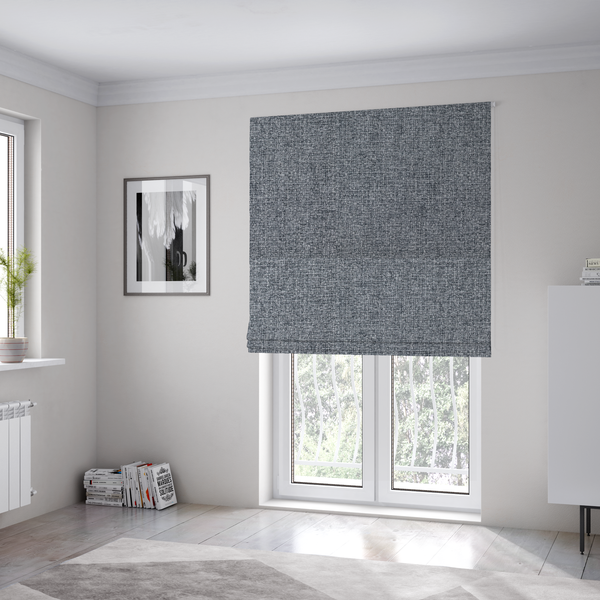 The fabric used to create these Roman blinds is a fabric in a dark steel or charcoal grey. The high-contrast weave features interlaced light grey and deep black fibres, creating a rugged, textured surface.