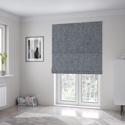 The fabric used to create these Roman blinds is a fabric in a dark steel or charcoal grey. The high-contrast weave features interlaced light grey and deep black fibres, creating a rugged, textured surface.