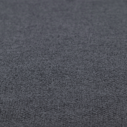 A fabric in a deep charcoal or carbon grey. The high-contrast weave features heavily interlaced black and slate grey fibres for a dense, rugged texture.