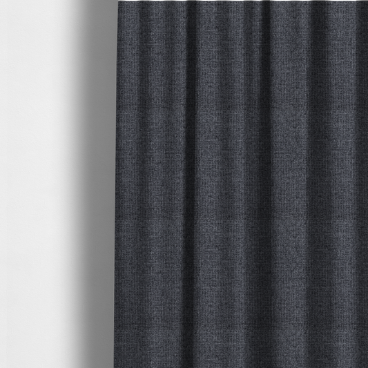 The fabric used to create these made-to-measure curtains is a fabric in a deep charcoal or carbon grey. The high-contrast weave features heavily interlaced black and slate grey fibres for a dense, rugged texture.