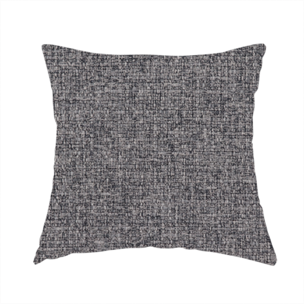 The fabric used to create this handmade cushion is a fabric in storm grey. A balanced mid-to-dark grey weave featuring a complex interlacing of ash and soot.