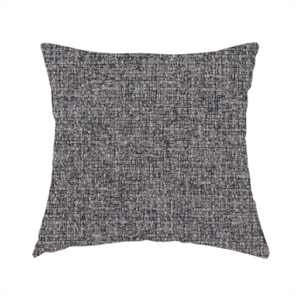 The fabric used to create this handmade cushion is a fabric in storm grey. A balanced mid-to-dark grey weave featuring a complex interlacing of ash and soot.