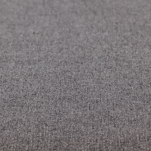 A fabric in storm grey. A balanced mid-to-dark grey weave featuring a complex interlacing of ash and soot.